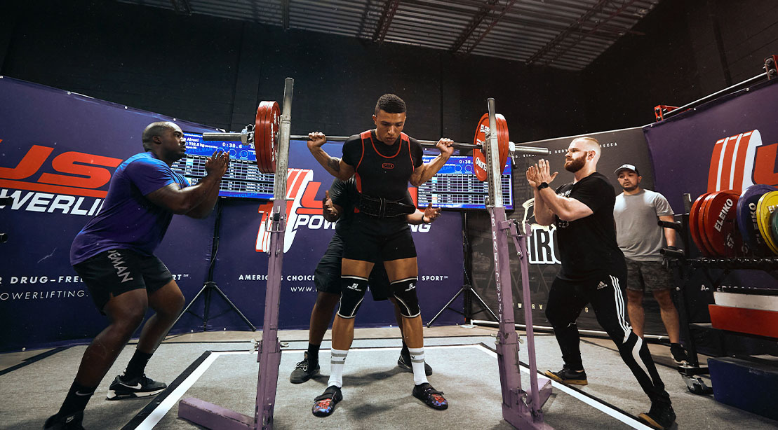United States Air Force Staff Sergeant Joshua Alvord performing a behind the neck squat